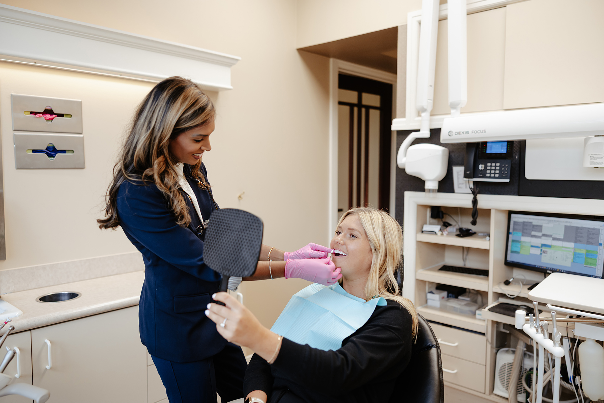 Cosmetic Dentistry Dr. Rainwater discussing treatment with a patient at Rainwater Drake Dental