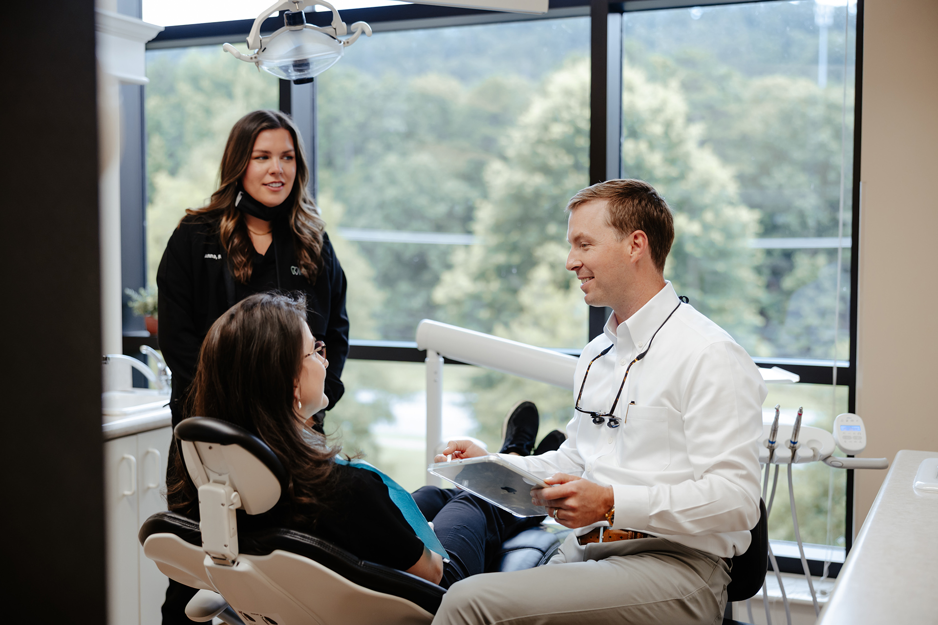 Cosmetic Dentistry Dr. Rainwater discussing treatment with a patient at Rainwater Drake Dental