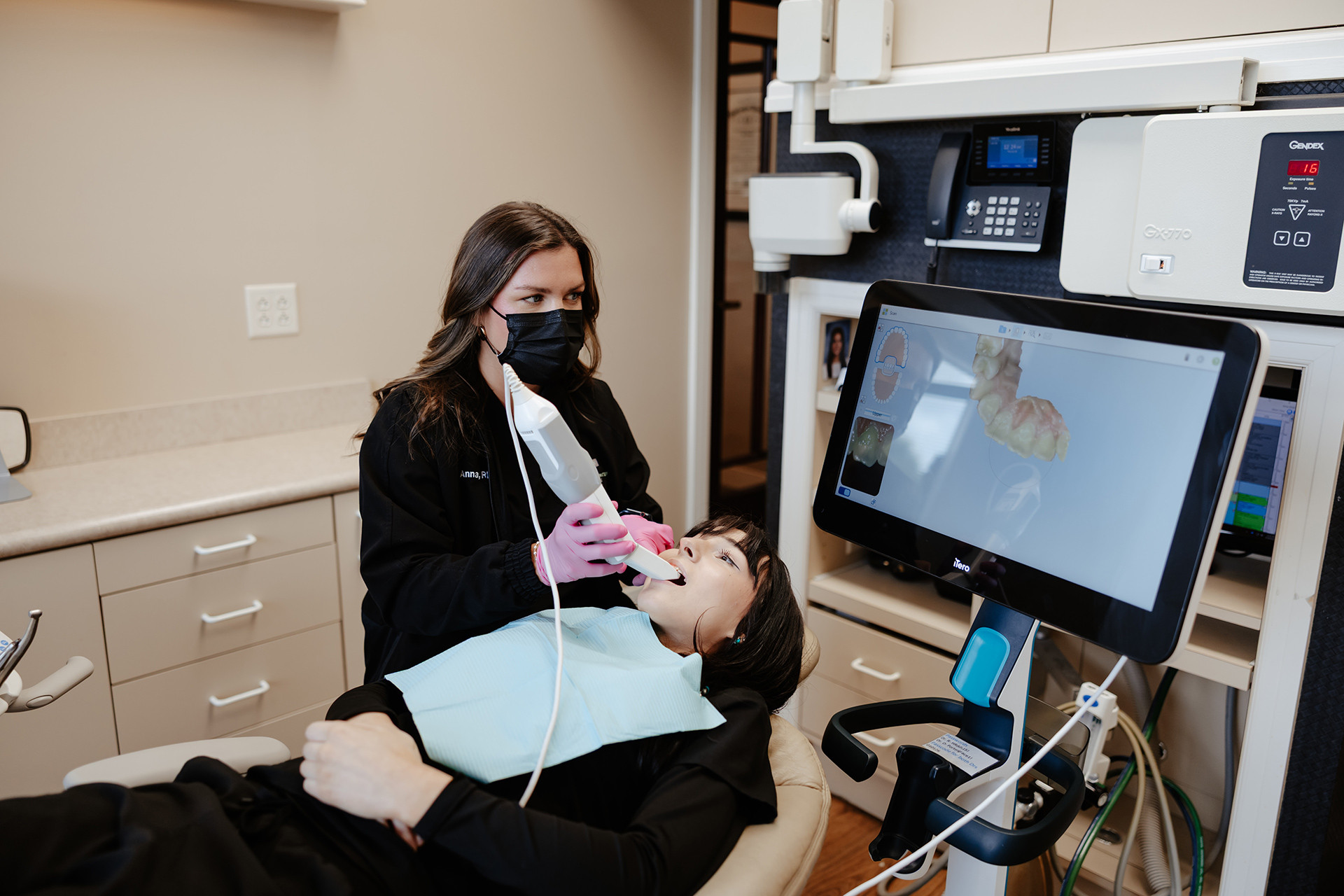 Cosmetic Dentistry Dr. Rainwater discussing treatment with a patient at Rainwater Drake Dental